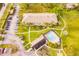 Aerial view showing condo building, pool, and ample parking at 1515 Forrest Nelson Blvd # H108, Port Charlotte, FL 33952