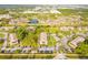 Aerial view showcasing the condo building, pool, and surrounding landscape at 1515 Forrest Nelson Blvd # H108, Port Charlotte, FL 33952