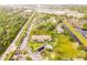 Aerial view of condo building, pool, and surrounding community at 1515 Forrest Nelson Blvd # H108, Port Charlotte, FL 33952