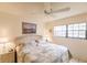 Comfortable bedroom featuring a king bed and ceiling fan at 1515 Forrest Nelson Blvd # H108, Port Charlotte, FL 33952