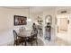Charming dining area with table, chairs and kitchen access at 1515 Forrest Nelson Blvd # H108, Port Charlotte, FL 33952
