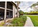 Exterior view showing building and landscaping with walkway at 1515 Forrest Nelson Blvd # H108, Port Charlotte, FL 33952
