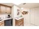 Kitchen with wood cabinets, granite countertops and a pantry at 1515 Forrest Nelson Blvd # H108, Port Charlotte, FL 33952