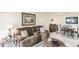 Relaxing living room featuring a brown reclining sofa and a marble-top coffee table at 1515 Forrest Nelson Blvd # H108, Port Charlotte, FL 33952