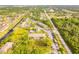 Aerial view of condo community, showing building location, pool, and parking at 1515 Forrest Nelson Blvd # H108, Port Charlotte, FL 33952