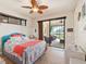 Comfortable bedroom with sliding doors leading to a patio at 15378 Taurus Cir, Port Charlotte, FL 33981