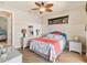 Bedroom with tiled floors, coastal decor, and a ceiling fan at 15378 Taurus Cir, Port Charlotte, FL 33981