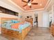 Main bedroom with large bed, access to the bathroom, and plenty of natural light at 15378 Taurus Cir, Port Charlotte, FL 33981