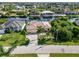 Aerial view of house and neighborhood by the canal at 15378 Taurus Cir, Port Charlotte, FL 33981
