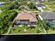Aerial view of canal front house with pool at 15378 Taurus Cir, Port Charlotte, FL 33981