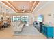 Spacious living area with reclining sofas, large TV, and access to the lanai at 15378 Taurus Cir, Port Charlotte, FL 33981