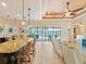 Modern kitchen with island seating and direct access to the pool area at 15378 Taurus Cir, Port Charlotte, FL 33981
