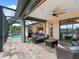 Relaxing covered patio with pool and wicker furniture at 15378 Taurus Cir, Port Charlotte, FL 33981