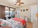 Bedroom with water view, tiled floors, and coastal decor at 15378 Taurus Cir, Port Charlotte, FL 33981