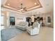 Relaxing living room with easy access to kitchen and outdoor spaces at 15378 Taurus Cir, Port Charlotte, FL 33981