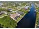 Aerial view of canal front property and neighborhood at 15378 Taurus Cir, Port Charlotte, FL 33981