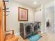 Well-appointed laundry room with storage and a folding bench at 15378 Taurus Cir, Port Charlotte, FL 33981