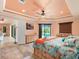 Main bedroom with pool views, large bed, and access to the bathroom at 15378 Taurus Cir, Port Charlotte, FL 33981