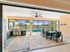 Outdoor patio with pool, table, chairs, and grill at 15378 Taurus Cir, Port Charlotte, FL 33981