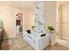 Bathroom with a luxurious soaking tub and marble wall feature at 15378 Taurus Cir, Port Charlotte, FL 33981