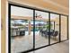 Outdoor patio with pool, table, chairs, and grill at 15378 Taurus Cir, Port Charlotte, FL 33981
