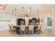 Modern kitchen with large island, granite counters, and pendant lighting at 15378 Taurus Cir, Port Charlotte, FL 33981