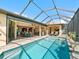 View of the pool and patio area from the house at 15378 Taurus Cir, Port Charlotte, FL 33981