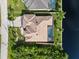 Aerial view of single Gathering home with pool and canal views at 15378 Taurus Cir, Port Charlotte, FL 33981