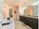 Elegant bathroom with marble accents, double vanity, and a large soaking tub at 15378 Taurus Cir, Port Charlotte, FL 33981