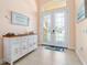 Bright entryway with decorative console table and beautiful double doors at 15378 Taurus Cir, Port Charlotte, FL 33981