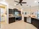 Spacious kitchen with granite countertops, stainless steel appliances, and an island at 15378 Taurus Cir, Port Charlotte, FL 33981