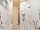 Spa-inspired bathroom with a walk-in shower and marble details at 15378 Taurus Cir, Port Charlotte, FL 33981