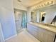 Large bathroom with double vanity, shower, and walk-in tub at 181 N Waterway Nw Dr, Port Charlotte, FL 33952
