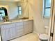 Bathroom with double vanity and granite countertop at 181 N Waterway Nw Dr, Port Charlotte, FL 33952