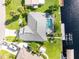 Aerial view of canal-front home with pool, dock, and boat at 181 N Waterway Nw Dr, Port Charlotte, FL 33952