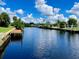 Tranquil waterfront property featuring a private dock and picturesque canal views at 181 N Waterway Nw Dr, Port Charlotte, FL 33952