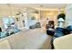 Open living room with ample seating, and views of the dining and kitchen areas at 181 N Waterway Nw Dr, Port Charlotte, FL 33952