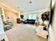Large living room with comfortable seating and a beautiful view of the backyard at 181 N Waterway Nw Dr, Port Charlotte, FL 33952
