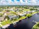 Aerial view of single Gathering home with private dock at 181 N Waterway Nw Dr, Port Charlotte, FL 33952