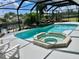 Inviting pool and spa with canal views at 181 N Waterway Nw Dr, Port Charlotte, FL 33952