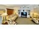 Spacious living room with light beige couch and chairs, creating a calm atmosphere at 181 N Waterway Nw Dr, Port Charlotte, FL 33952