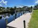 Private dock with covered boat lift on a calm waterway at 181 N Waterway Nw Dr, Port Charlotte, FL 33952