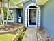 Inviting front entry with a pelican statue and stone landscaping at 181 N Waterway Nw Dr, Port Charlotte, FL 33952
