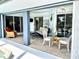 Relaxing screened patio with seating area and view of the pool at 181 N Waterway Nw Dr, Port Charlotte, FL 33952