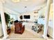 Relaxing living room featuring comfortable seating, a large TV, and plenty of natural light at 181 N Waterway Nw Dr, Port Charlotte, FL 33952