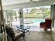 Inviting screened pool and spa area with comfortable seating, overlooking a canal at 181 N Waterway Nw Dr, Port Charlotte, FL 33952