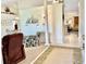 Bright and airy entryway with tile flooring and views into the living room and dining area at 181 N Waterway Nw Dr, Port Charlotte, FL 33952