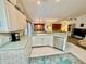 Efficient kitchen with ample counter space and breakfast bar at 181 N Waterway Nw Dr, Port Charlotte, FL 33952