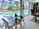 Relaxing screened pool and spa area with canal views at 181 N Waterway Nw Dr, Port Charlotte, FL 33952