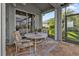 Enjoy this relaxing patio with comfortable seating and a table at 3589 Pennyroyal Rd, Port Charlotte, FL 33953